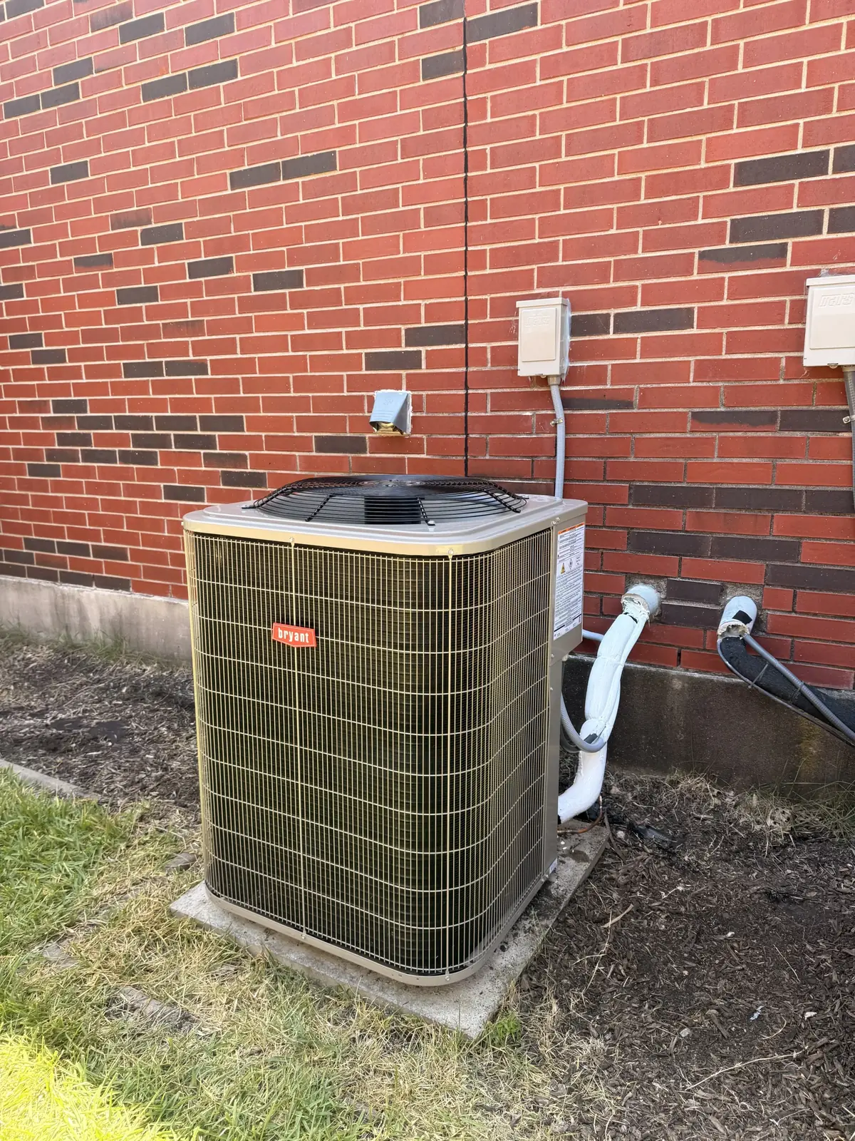 HVAC unit installed outside a building in Pflugerville, TX, showcasing reliable HVAC services Pflugerville TX.